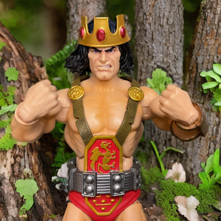 Super7 Ultimates Kull the Conqueror action figure wearing removable gold crown with red gems, royal barbarian pose.