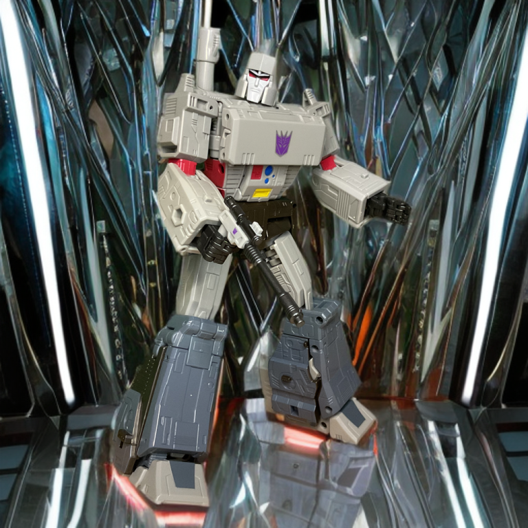 Studio Series Megatron action figure posed in dynamic fighting stance, silver blade contrasting silver body.