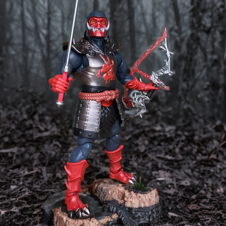Ninjor’s dragon mask, worn on the figure, with red eyes visible and intricate chest armor featuring a red dragon emblem in the foreground.