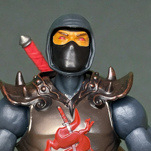 Close-up of the Masterverse Close up of Ninjor with black ninja mask and red eyes glowing menacingly.