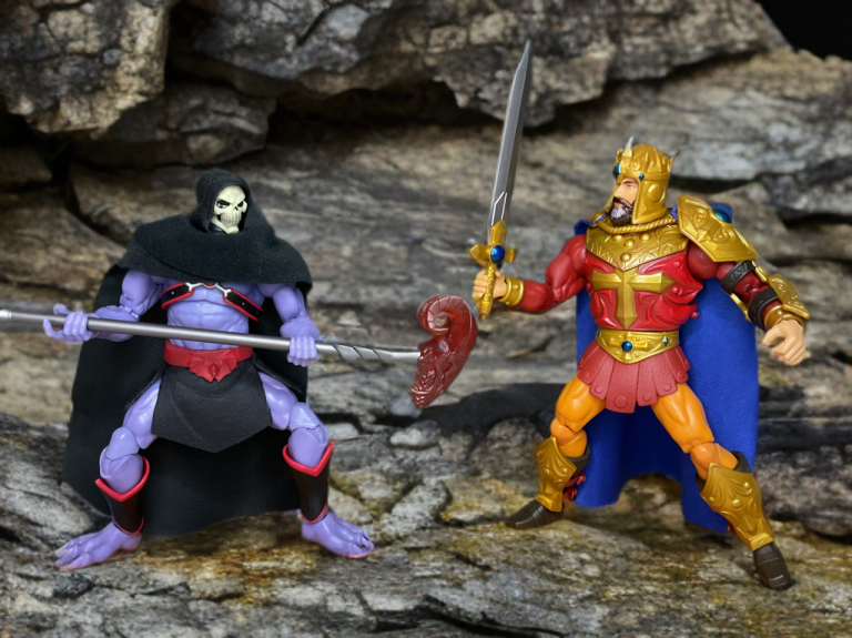 The Masterverse King Randor figure in a battle stance, holding a scepter that combines with a sword to form a spear, with removable armor and a helmeted head option.