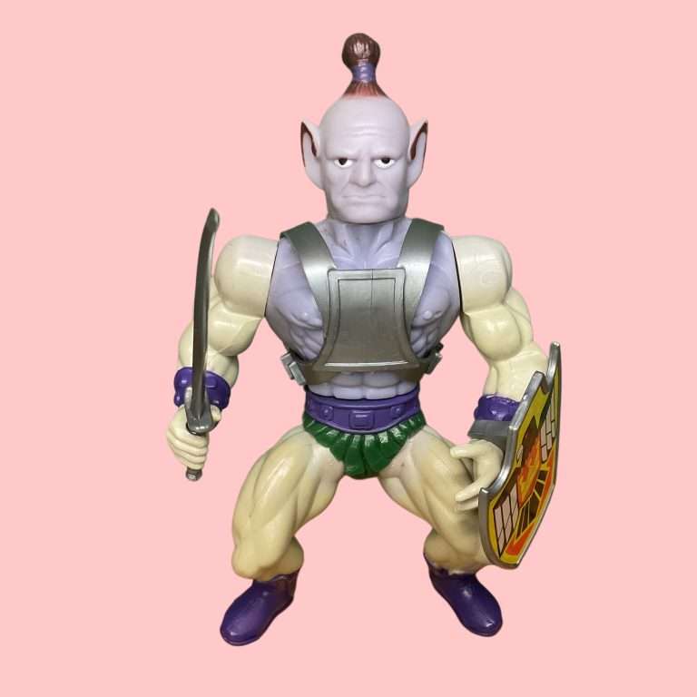 Blue-skinned Baltard action figure with pointy ears, topknot hairstyle, and battle axe, from the original Sungold Galaxy Warriors line.