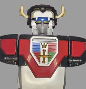 A close-up of Voltron’s face from Playmates’ 40th Anniversary set, highlighting its glowing eyes and detailed helmet design.