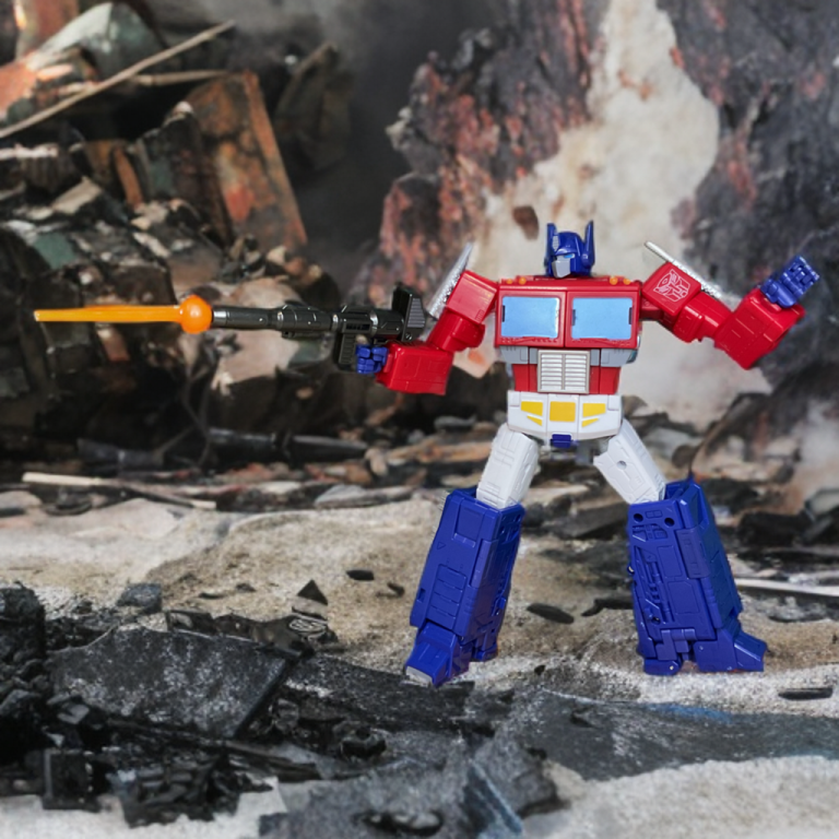 A close-up of the Studio Series 86-31 Optimus Prime’s head sculpt, with light blue eyes and a blue helmet, set against a blurred Autobot City backdrop.