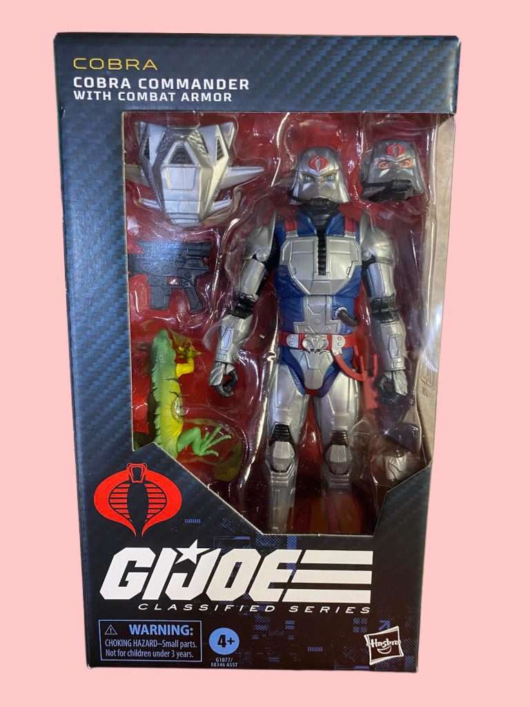 A 6-inch Cobra Commander #168 figure in blue and red combat armor, posed with a blaster and pet iguana, displayed in a collector-friendly windowed box.