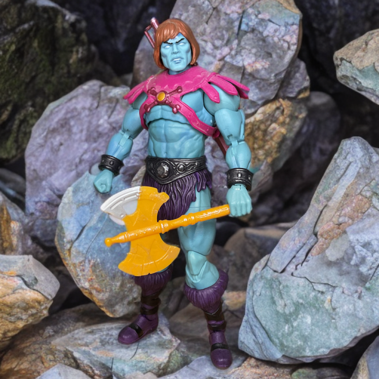 New Eternia Faker in blue armor, posing as He-Man with laser eyes against a rocky Eternia background.