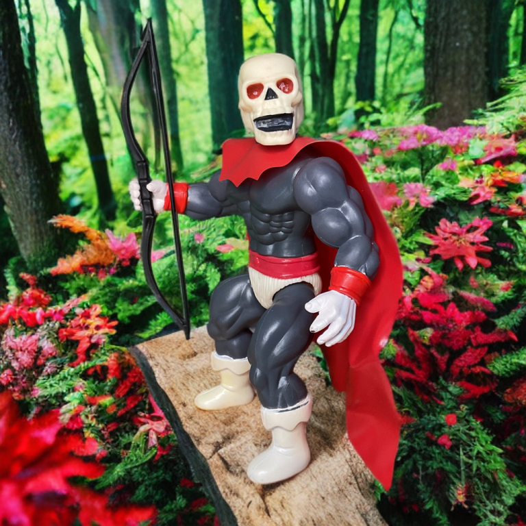 Skull Man in archer pose, with red cape flowing amid pink flowers.