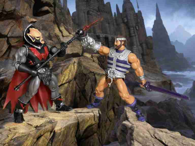 Hordak facing Fisto with a staff and sword on a cliff in a MOTU Classics image.