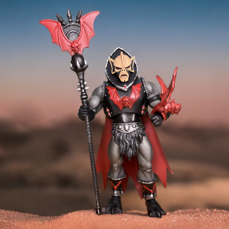 Close-up of Hordak holding his bat-winged staff in a solo MOTU Classics photo against a sandy backdrop.