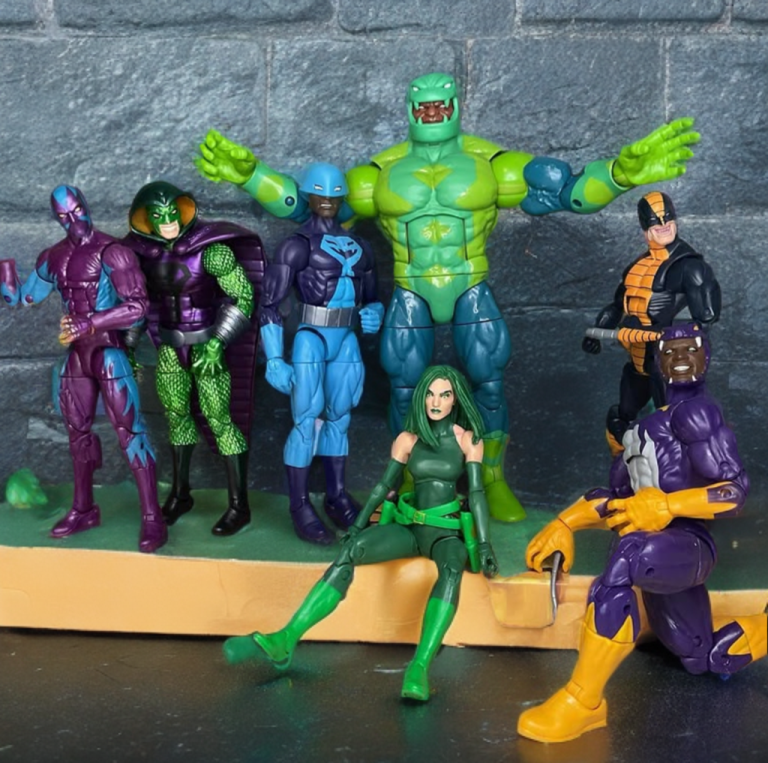 A group shot of the Serpent Society, including Cottonmouth, Eel, Cobra, and others in snake-themed costumes, gathered in a dimly lit lair, plotting their next move.