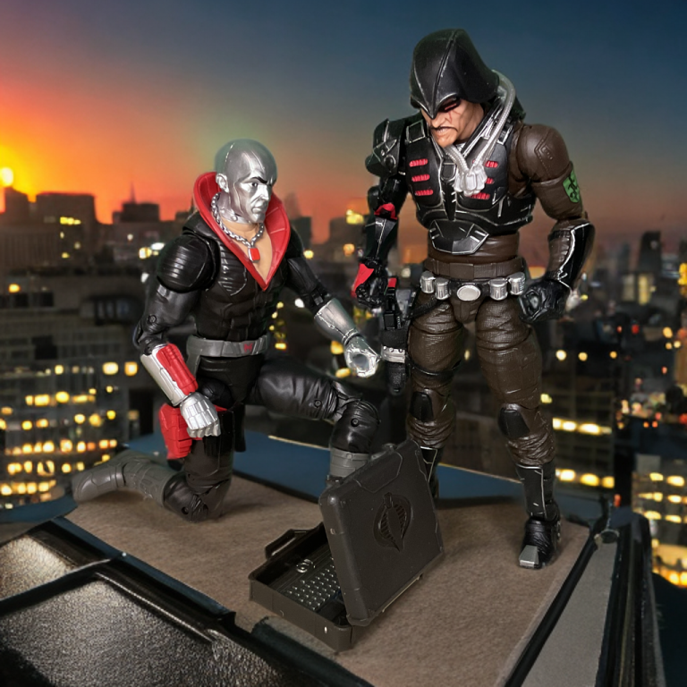 On a penthouse rooftop at sunset, Destro, in a black uniform with a red collar, kneels to open a black briefcase as Major Bludd, in a dark tactical outfit, leans in to inspect. The cityscape glows below, framed by vibrant orange and purple skies.