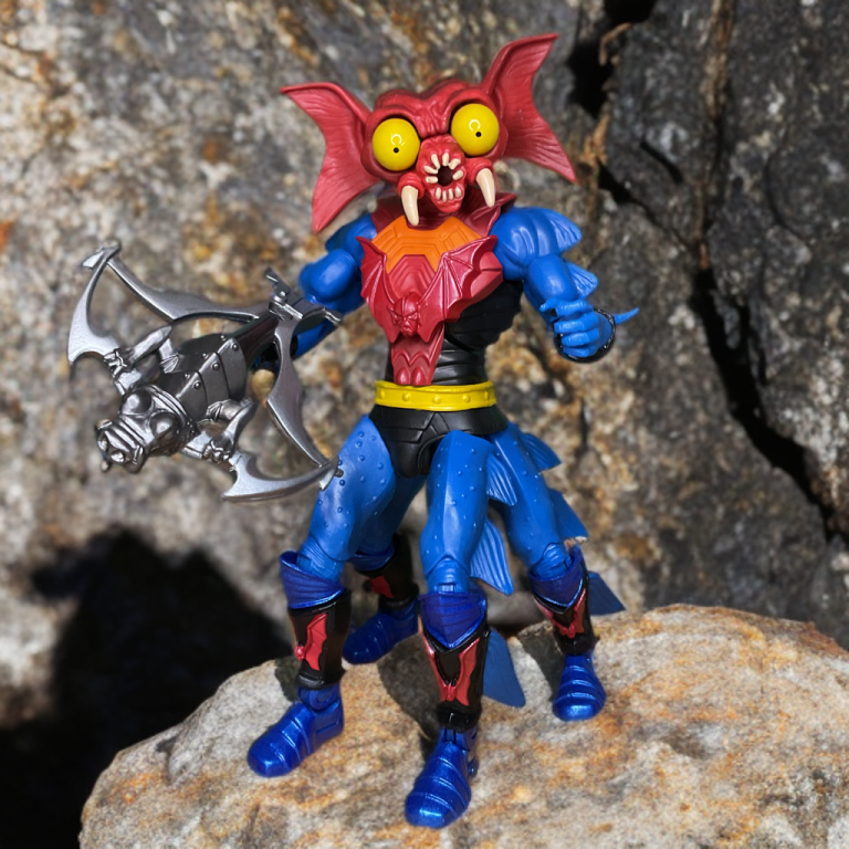 Mantenna with extended eyes and crossbow in a volcanic MOTU Classics photo.