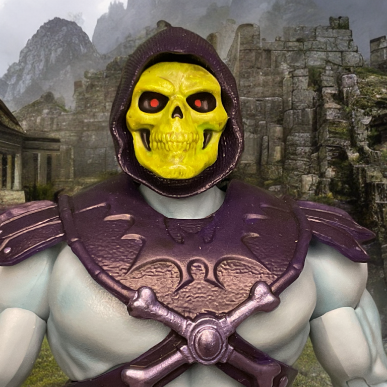 Close-up of the Walmart-exclusive Masterverse Vintage Skeletor figure, showcasing its green-tinted skull face and red glowing eyes.
