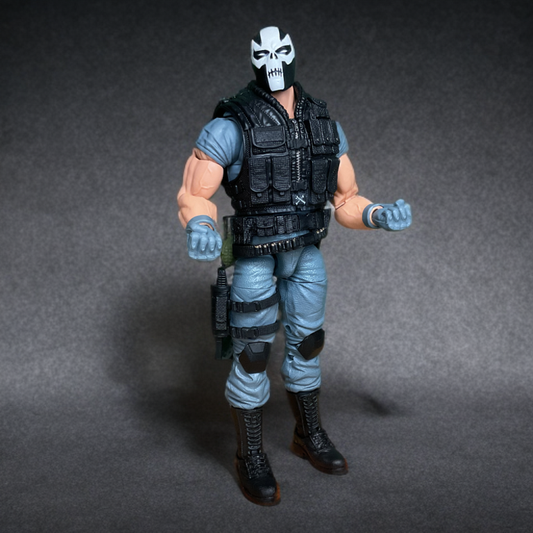 Crossbones Marvel Legends figure in a black and red tactical outfit, with a knife strapped to his thigh.