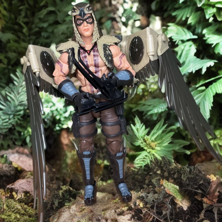 A dynamic G.I. Joe Classified #139 figure set, featuring Chip "Raptor" Talon in a dynamic pose with claws against a forested background.