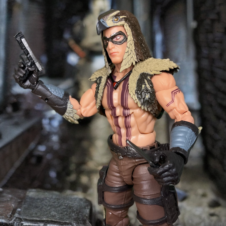 Chip "Raptor" Talon from G.I. Joe Classified #139, posed with a pistol and cowl, against a dynamic diorama.