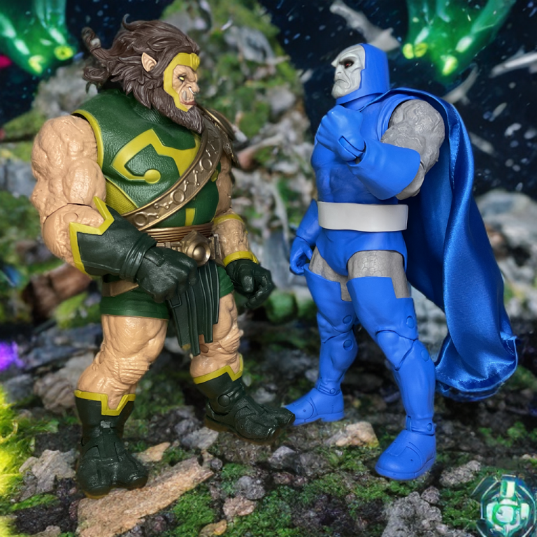 Two DC Universe action figures of Darkseid and Kalibak, in a battle-ready stance, both intricately sculpted with Apokoliptian details, displayed on a rocky terrain base.