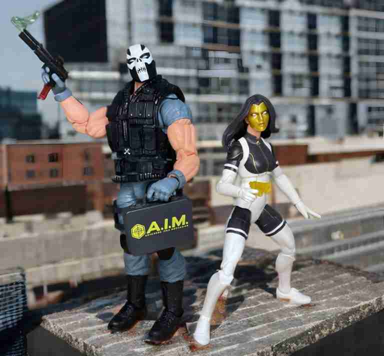 Crossbones and Masque back to back on a cityscape.