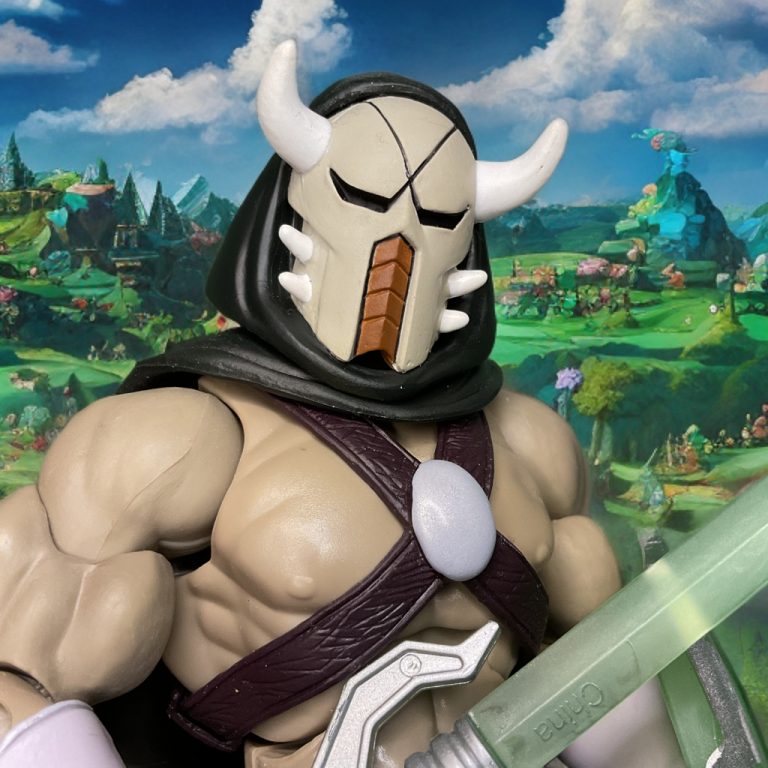Lord Masque standing in front of an Eternian backdrop.