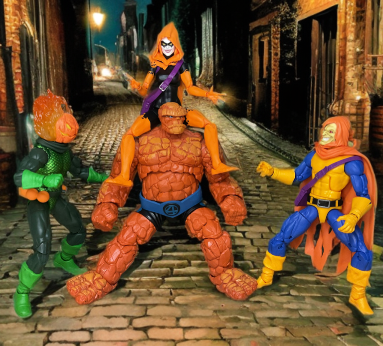In a narrow alley, Hobgoblin, Hallow’s Eve, and Jack O’Lantern surround the Thing, their vibrant costumes—orange capes, skeletal masks, and flaming pumpkin heads—casting eerie light on cobblestones, with brick walls and a twilight sky heightening the Halloween clash.