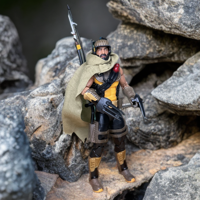 The G.I. Joe Classified Desert Scorpion figure, adorned with Cobra insignia, grips his iron claws against a rocky backdrop.