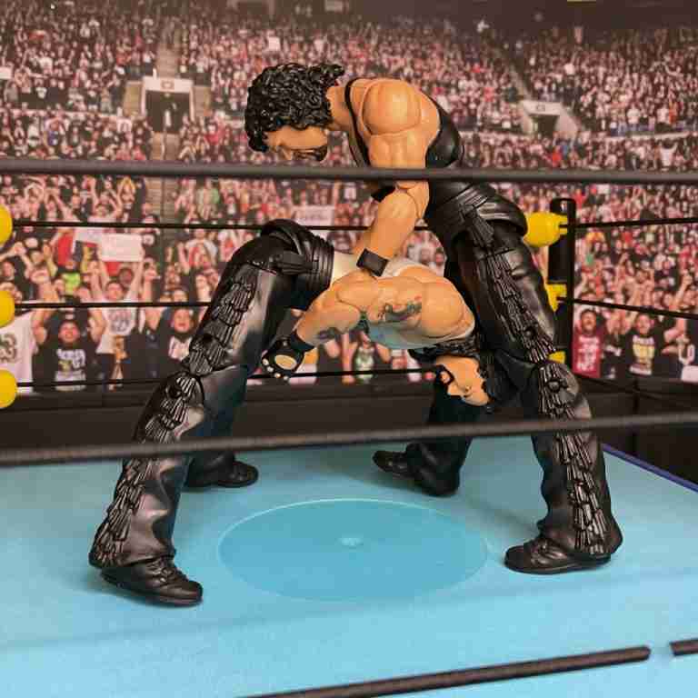 Plastic Diesel figures locked in a historic wrestling match.