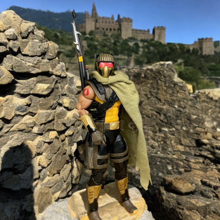 A dynamic pose of the G.I. Joe Classified Desert Scorpion figure, equipped with a backpack and knives
