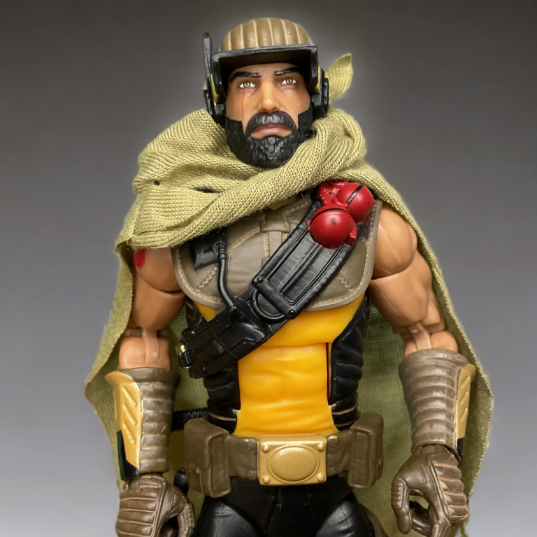 The Cobra Desert Scorpion, with a swappable faceplate and softgoods cape, against a neutral backdrop.