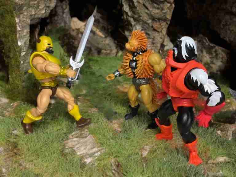 Kol-Darr with sword raised high confronts Spikor and Stinkor.