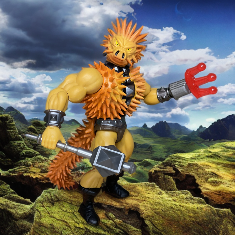 Eine 5,5 Zoll große Spikor-Figur mit erdigen Stacheln und einem gewundenen Schwanz steht bedrohlich da. Die Verpackung zeigt eine dynamische Skizze von Spikor, der angreift, mit bernsteinfarbenen Highlights und MOTU-Lore.