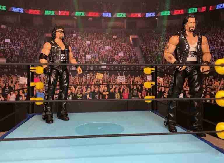 Titan Diesel action figures clashing in a ring battle.