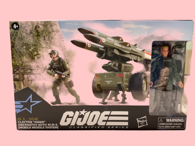 Close-up of the Classified Series #182 box, showcasing vibrant artwork of Hawk with the MMS trailer firing a missile in the background.