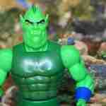 Detailed head sculpt of Whiplash with ridges, fangs, and glowing eyes, capturing his sly, scheming expression from Filmation animation.