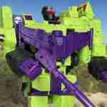 Devastator in an arid desert with mountains in the background.