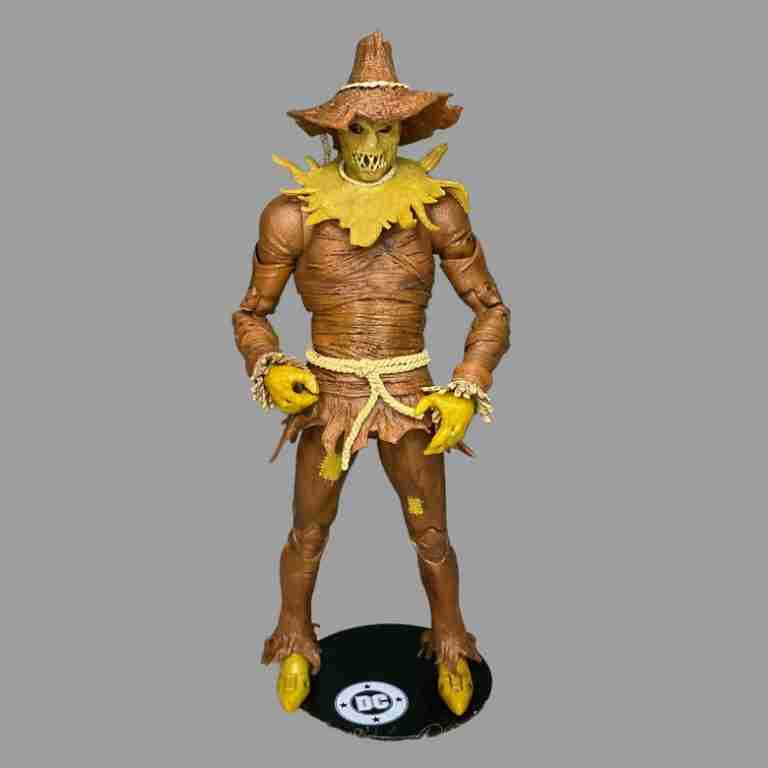 The Scarecrow figure displayed on a black DC logo base with its lanky frame towering over other DC Multiverse figures.