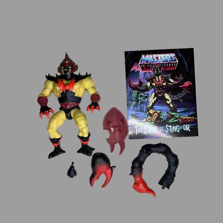 Sting-Or blister removed—fully assembled red scorpion figure beside accessories on white.