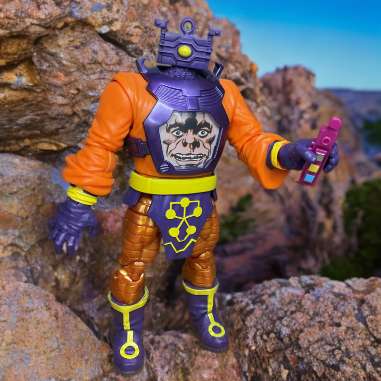 Arnim Zola figure's translucent orange chest screen displaying eerie holographic face, with remote control accessory.